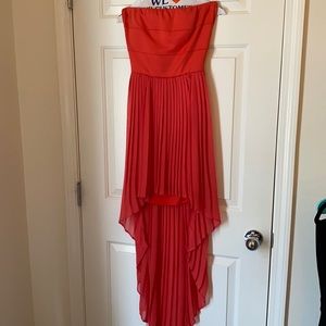 Strappless, coral color, hi-low dress
